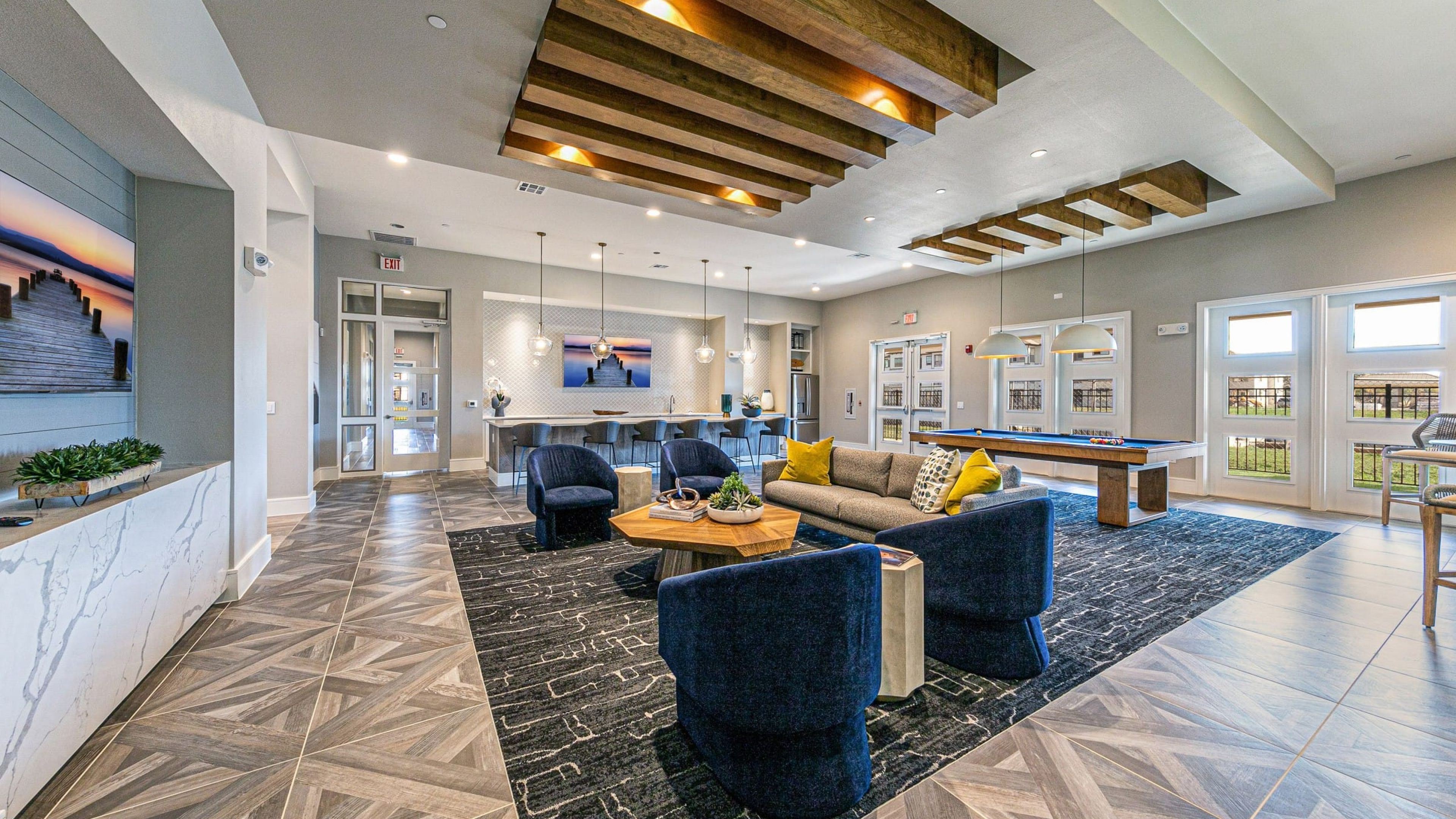 Hawthorne at Bay Forest resident clubhouse amenity with seating area, full kitchen and billiards table