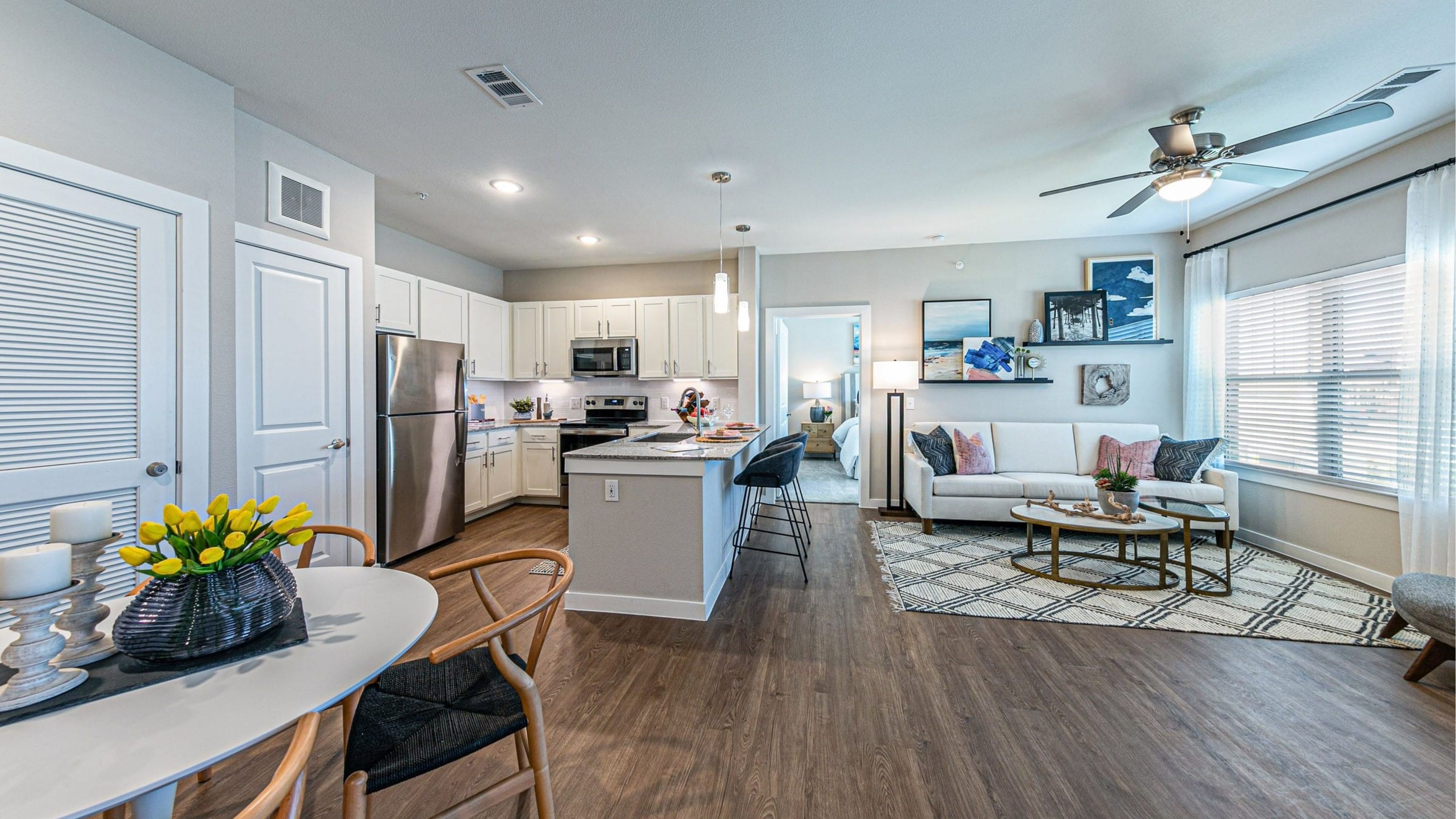 Hawthorne at Bay Forest apartment kitchen and living space with wood floors and large open plan living area