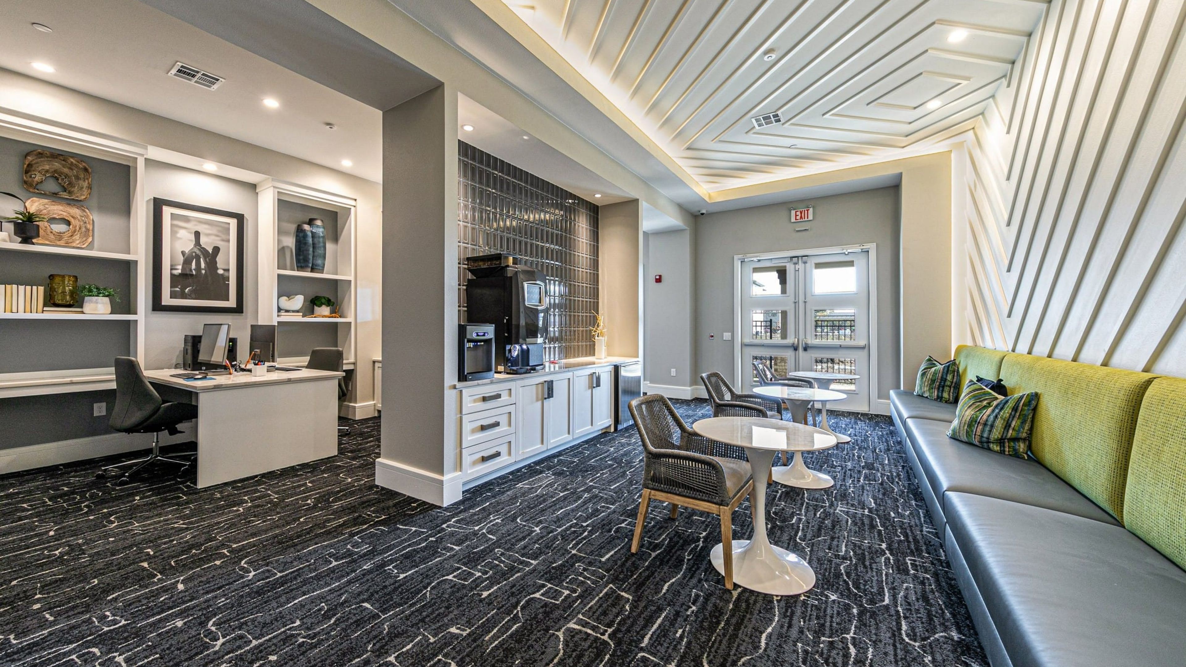 Hawthorne at Bay Forest resident clubhouse amenity with seating area, coffee bar, and beautiful finishes