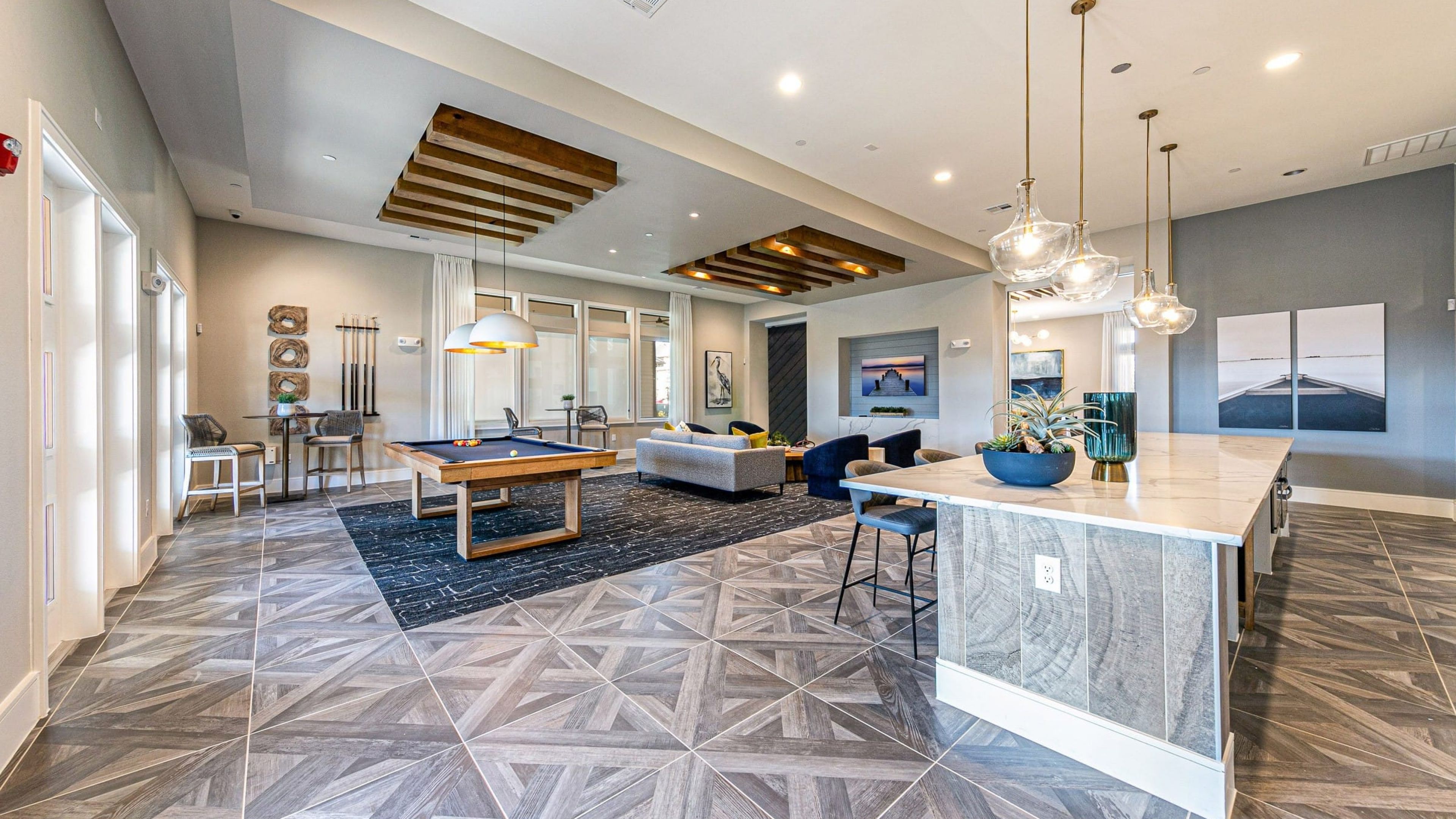 Hawthorne at Bay Forest resident clubhouse amenity with seating area, full kitchen and billiards table